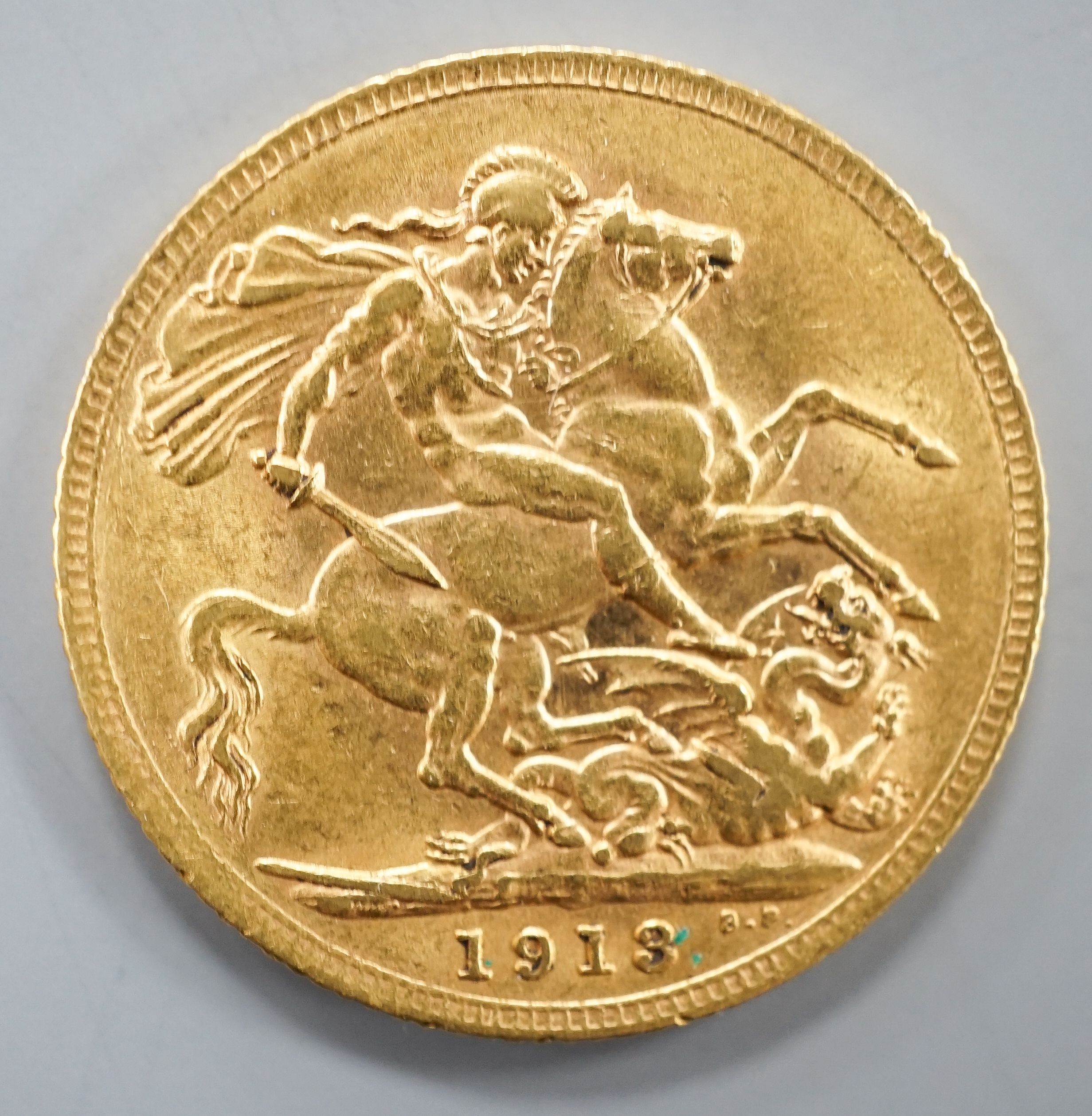 A George V 1913 gold sovereign.